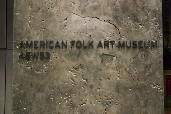 White bronze panels, cast in an art foundry, make up the Folk Art Museum's fa&ccedil;ade.