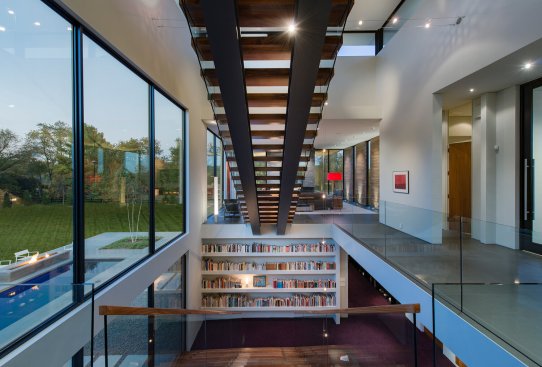 Walker Road modern home floating stairs over the library reading room