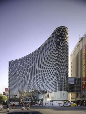 During the day the fa??ade acts as sunscreen and weather barrier and transforms into a luminous curtain at night.