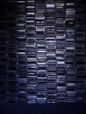 A wall of recycled toner cartridges references the waste associated with printing today. Recycling 1 cartridge saves 3.6 lbs. of solid waste. En masse they create a unique texture and emphasize that beauty can come from unexpected places.  
