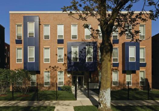 Building walls are 8-inch-thick precast concrete with thin brick cast into the molds at the street facades.
