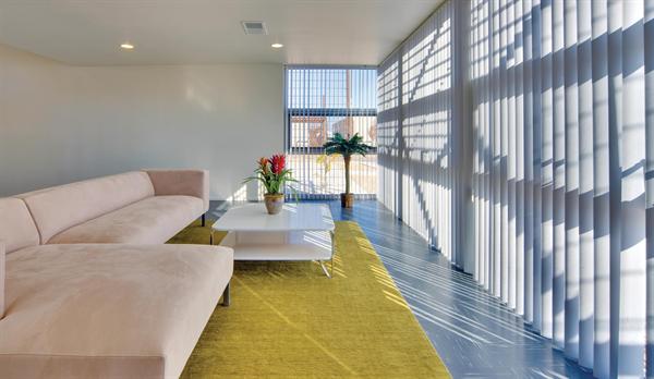 Credit: Patrick Coulie The interiors enjoy ample daylight. The concrete floors provde thermal mass.