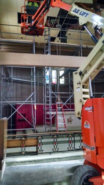 Parishioners came in at night for three weeks to remove the old, stained mineral fiber ceiling, paint the grid black, and install the new wood-grain thermoformed ceiling.
