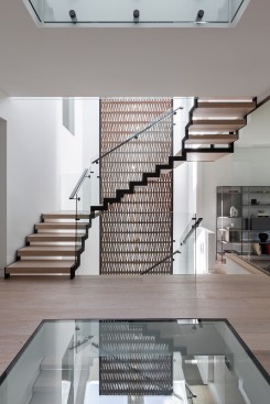 Atelier RZLBD / Stack House / staircase, terracotta screen, glass floor