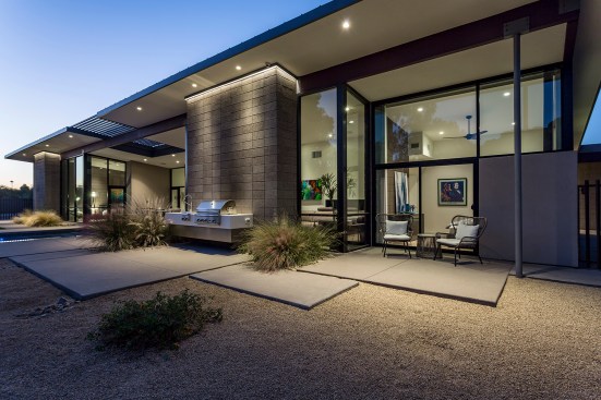 Back guest patio is accessible to the nearby front guest parking as well as to the back pool patio. The 
large glass clerestory provides ample views to the mountains beyond and light while limiting direct sun light. 