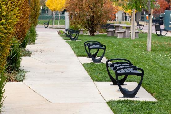 Trio Benches shown in 6 foot, backless configuration with Black Texture powdercoated frame, extruded aluminum slats and two armrests at BART, Pleasant Hill/Contra Costa Centre Station, Walnut Creek, California