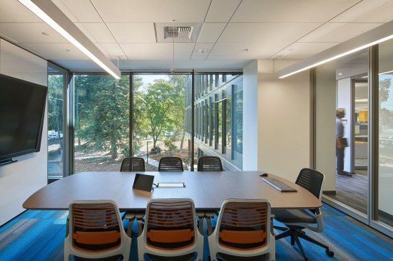 The open stair provides a means of vertical circulation from basement to fourth floor of the building. During renovation, the central core was expanded by 20 feet on either side.
