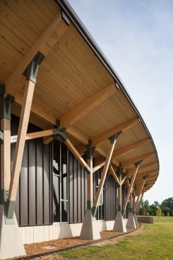 The Welcome Center's exterior consists of two types of exterior walls - the board-formed concrete, and this prefinished bronze-colored metal standing-seam siding over gypsum sheathing.