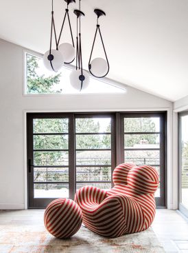 It all began with the red striped chair.
A rebellious 1969 creation by designer Gaetano Pesce, the “Serie Up” chair has a story: Its shape was meant as a political message, one denouncing the treatment of women in the world.
Full of style and meaning, it perfectly represents the flair of this colorful, vibrant couple.
