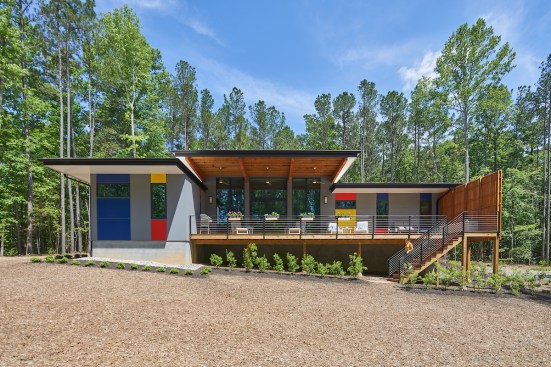 The bright colors on the private side signify the owners' freedom from their previous "development" house.
