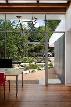 View from painting studio to rock garden and carport