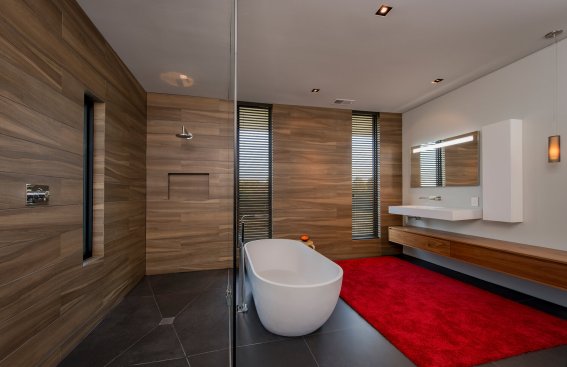 Walker Road modern bathroom design with freestanding soaking tub and wood tile walls