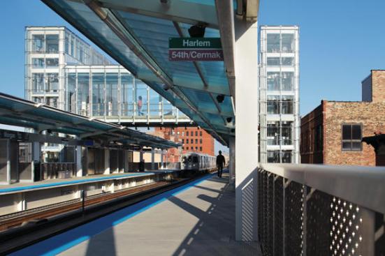 The+station%e2%80%99s+two+elevated+platforms+are+connected+by+a+pedestrian+bridge.+Polycarbonate-and-painted-steel+canopies+provide+shelter+from+the+elements+for+those+waiting+for+their+trains.