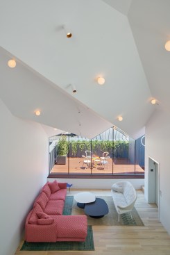 The addition’s roofline creates a dramatic ceiling in the sixth-floor living space, which features the solid ash plank flooring used throughout.