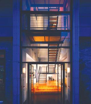 And they skillfully punctured the house with industrial-style windows and doors to promote an indoor/outdoor relationship.