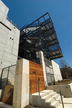 The fire escape pitches over poured-in-place concrete walls.