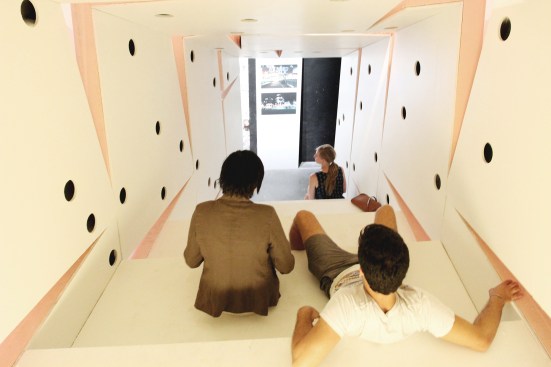 Exhibited at the 2012 Venice Architecture Biennale, the About Face installation is a proposal for residences in Detroit that reorients existing structures and makes use of vacant lots. The structure comprises 21 fiber-reinforced resin panels that act as both a room and a staircase.  