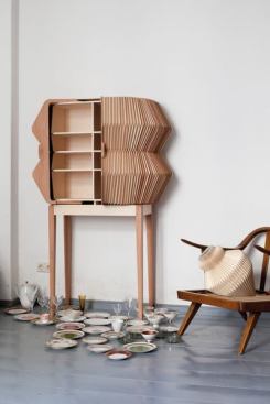 Following up on her lauded wood-veneer textile, Eliza Strozyk (with artist Sebastian Neeb) dressed the Accordion Cabinet in garmentlike wooden knife pleats. 
elisastrozyk.de