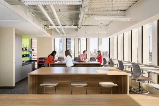 Open+work+areas+and+workspaces+where+employees+can+congregate+as+a+team
