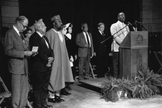 From the University of Pittsburgh: "Members of the African Heritage Room Executive Committee and other senior members of the University of Pittsburgh stand at the front of the Dedication Ceremony for the African Heritage Room on December 17, 1989. At the dedication, an African blessing was conducted by Dr. J. H. Kwabena Nketia, ambassadors wore colorful African clothing, and traditional music filled the Commons Room at the Cathedral of Learning."