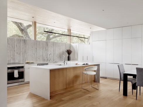 Custom cabinetry and Caesarstone countertops outfit the primary kitchen. 