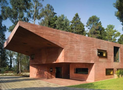 Ethiopia

Royal Netherlands Embassy, Addis Ababa, Ethiopia, 2005 (Dick van Gameren
 and Bjarne Mastenbroek) The concrete of the long, low main embassy 
building is pigmented red to allude to the historic rock-hewn buildings 
of Ethiopia.