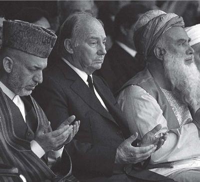 The Aga Khan (center) 
joins Afghan president Hamid Karzai (left) and Abdul Rasul Sayyaf 
(right), a Pashtun warlord turned Afghan legislator, in praying at the 
funeral of Mohammed Zahir Shah-Afghanistan's last king-in July 2007. 
Above right: the jury and steering committee for the 2004-2007 cycle, 
which include Hani Rashid, Billie Tsien, and Brigitte Shim.