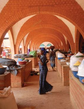 Burkina Faso

Central Market, Koudougou, Burkina Faso, 2005 (Swiss Agency for 
Development and Cooperation, Laurent S&eacute;chaud, and Pierre J&eacute;quier) 
Located in the capital of the West African republic of Burkina Faso 
(formerly known as Upper Volta), the central market reveals the full 
potential of a humble building material. Blocks of compressed earth were
 used to form domes, vaults, and arches that ennoble the civic space.