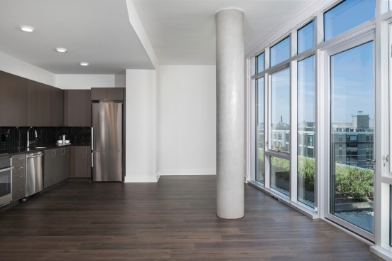 Unique design elements, including columns in unit, recall the area’s industrial past.