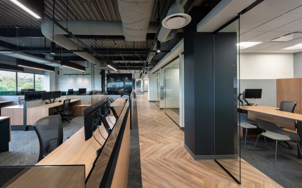The office is organized into a public and a more private side with a combination of private and open offices.