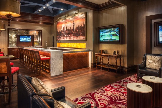 The lounge bar is made
of book-matched wood with a stone top. A large 16.5 foot silhouette of
London was requisitioned for display above the bar.