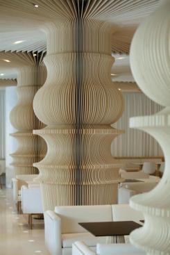 The layers of wood covering the columns are affixed to an MDF core.