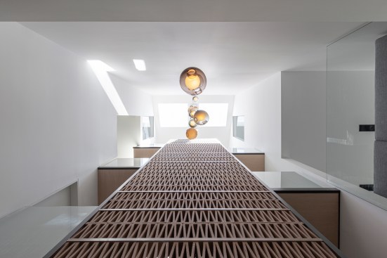 Atelier RZLBD / Stack House / terracotta screen, void, stack, shaft