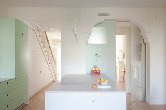 The BedStuy Passive House in Brooklyn, N.Y., is a Victorian townhouse renovated to become a certified Passive House with the aim of retaining as much of the original character of the building as possible while reducing its operational energy use. The envelope was substantially insulated on the interior of the building and new triple-pane windows were installed. Operable exterior shades were tucked behind the existing brownstone to mitigate solar heat gain when closed.
