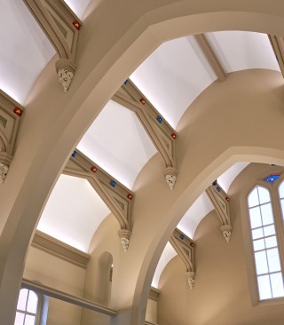 Linear uplights, concealed within custom metal replicas of the rail form, serve to provide volumetric as well as task illumination.