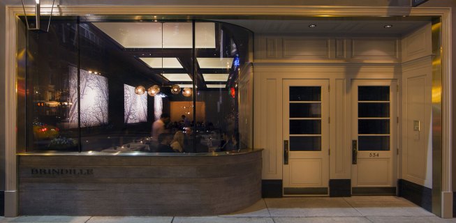 Brindille’s curved fa&ccedil;ade lends to subdued, intimate interior that complements the restaurant’s namesake tree-branch theme.