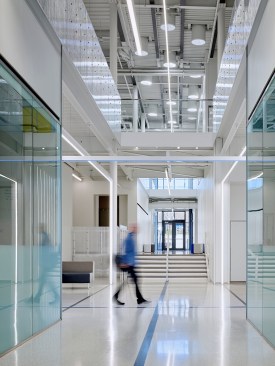Inside, bright reflective floors give way to high, open ceilings.
