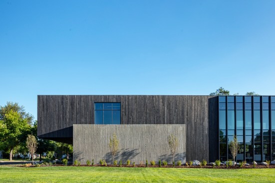 A striking contrast of cast-in-place concrete and darker Shou Sugi Ban wood clad the exterior of Okland Construction’s Salt Lake City Headquarter, showcasing their craftsmanship and uncompromising dedication to quality.