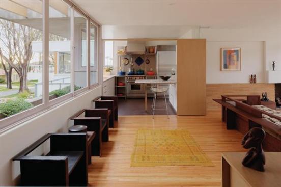 The architect removed a piece of cabinetry between the kitchen and living room.