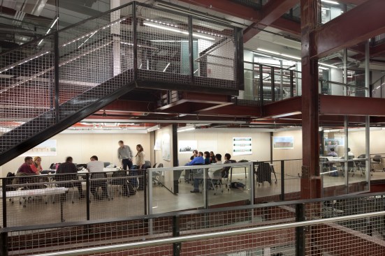 Partial+mezzanine+floors+along+the+new+atrium+free+up+space+for+circulation+and+other+shared+functions.
