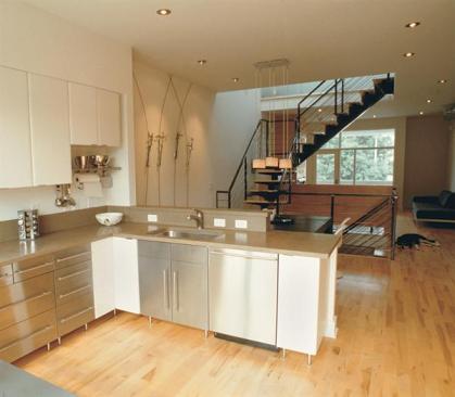 The unit pictured has a raw steel staircase with steel tubing and maple treads.