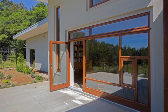 The custom window composition frames the view out to the meadow.