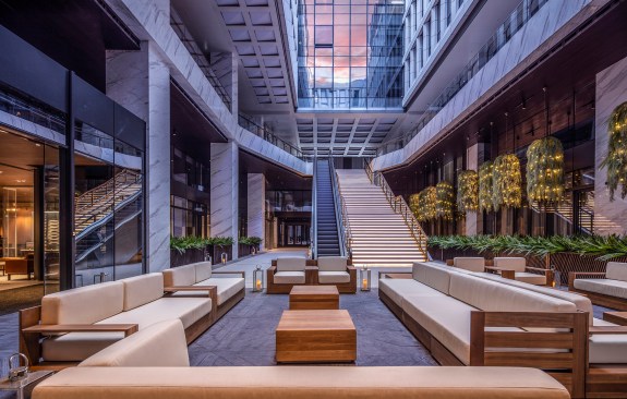 Spotlights are placed above the leisure area of the atrium to simulate the moonlight, creating vacation vibes 