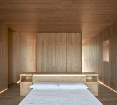 A lighting control system helps save energy by automating the balance between natural and artificial light in spaces such as the bedrooms.