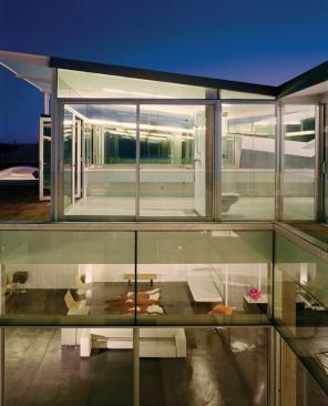 On the main living level, 8-foot-tall cabinetry in the kitchen, baths, and storage areas becalm the lofty interior.