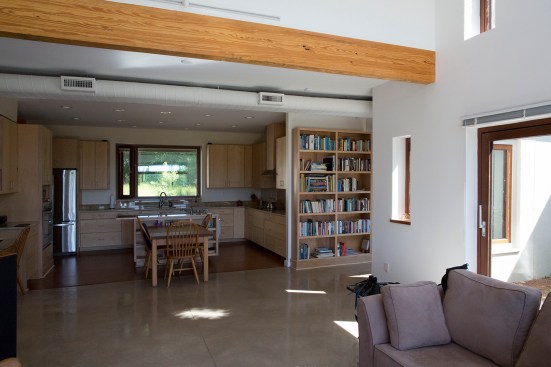 View from the living room space through the dining area to the kitchen.