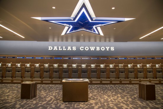 Inside the Cowboys player locker room where bold brand graphics recognize the storied franchise in classic way consistent with the organization’s culture