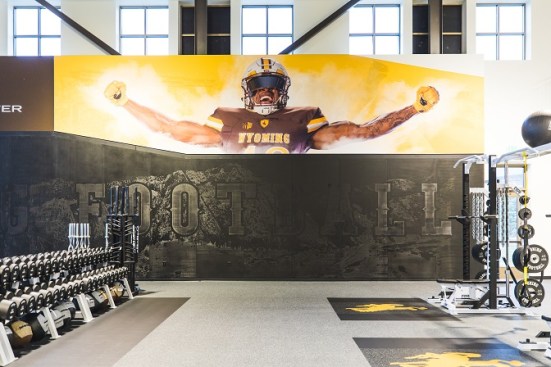 Inspiring graphics and photographs of Wyoming student-athletes throughout the HAPC training room
