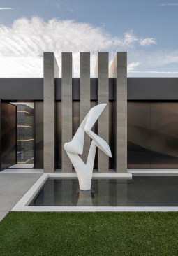 Serenity Indian Wells modern architectural luxury home with Richard Erdman entry sculpture