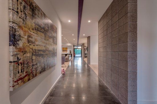 The angle of roof allows the interior spaces to open up to the views beyond without cutting off the tops 
of the mountains in the distance while also forcing the roof water back towards two rain water collection main 
points.  The simplicity of the roof design helps create a straight forward rain collection system. 